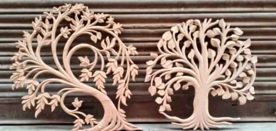 A carved vine relief, cut by hand
